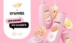 Prodotti Dove x Crumble color rosa chiaro con l'immagine di un cookie con granella colorata